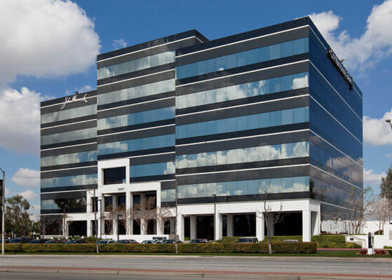 Exterior view of the 7 story all glass Metroplex Building