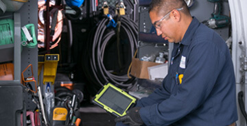 Mesa technician reviewing a project on a tablet